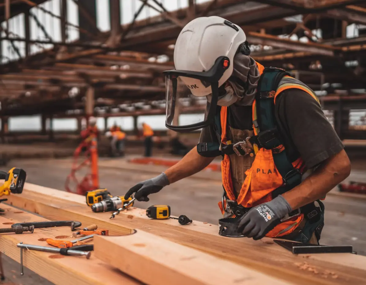 A construction worker in hi-vis working on site